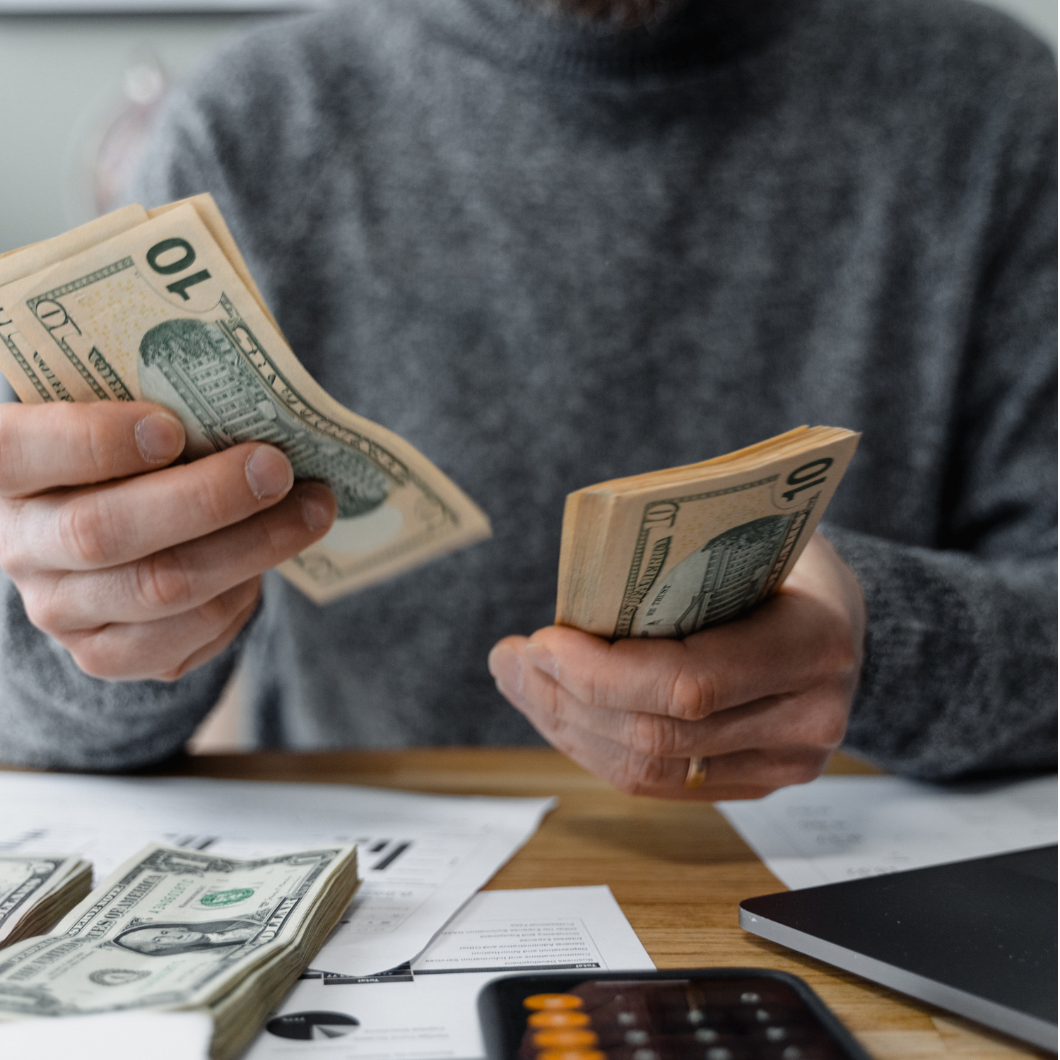 woman counting money for her savings