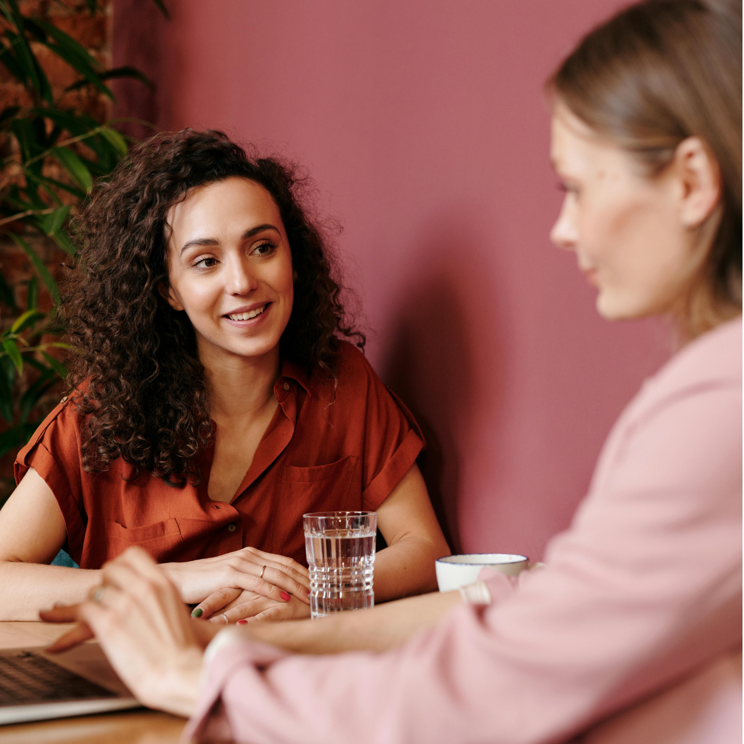 two women discussing their finances together
