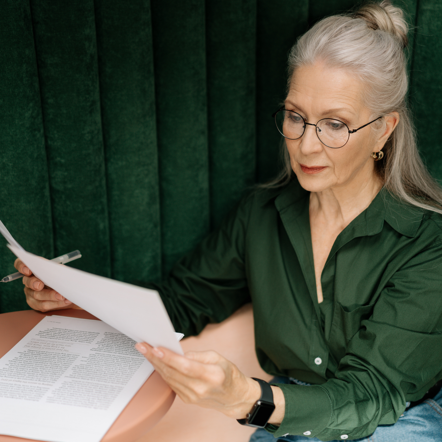 Confident woman reviewing monthly expenses and financial goals on a laptop