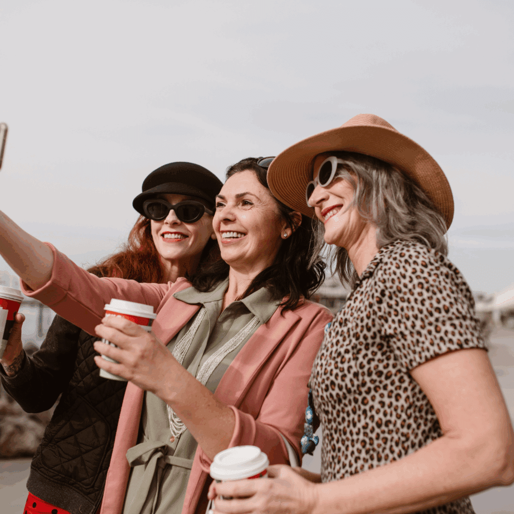 a group of 3 women working on their finances