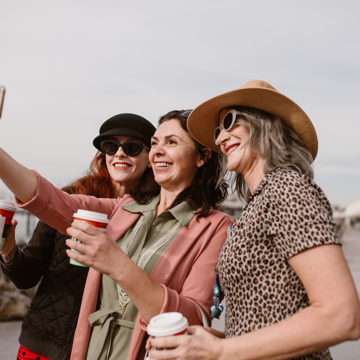 a group of 3 women working on their finances