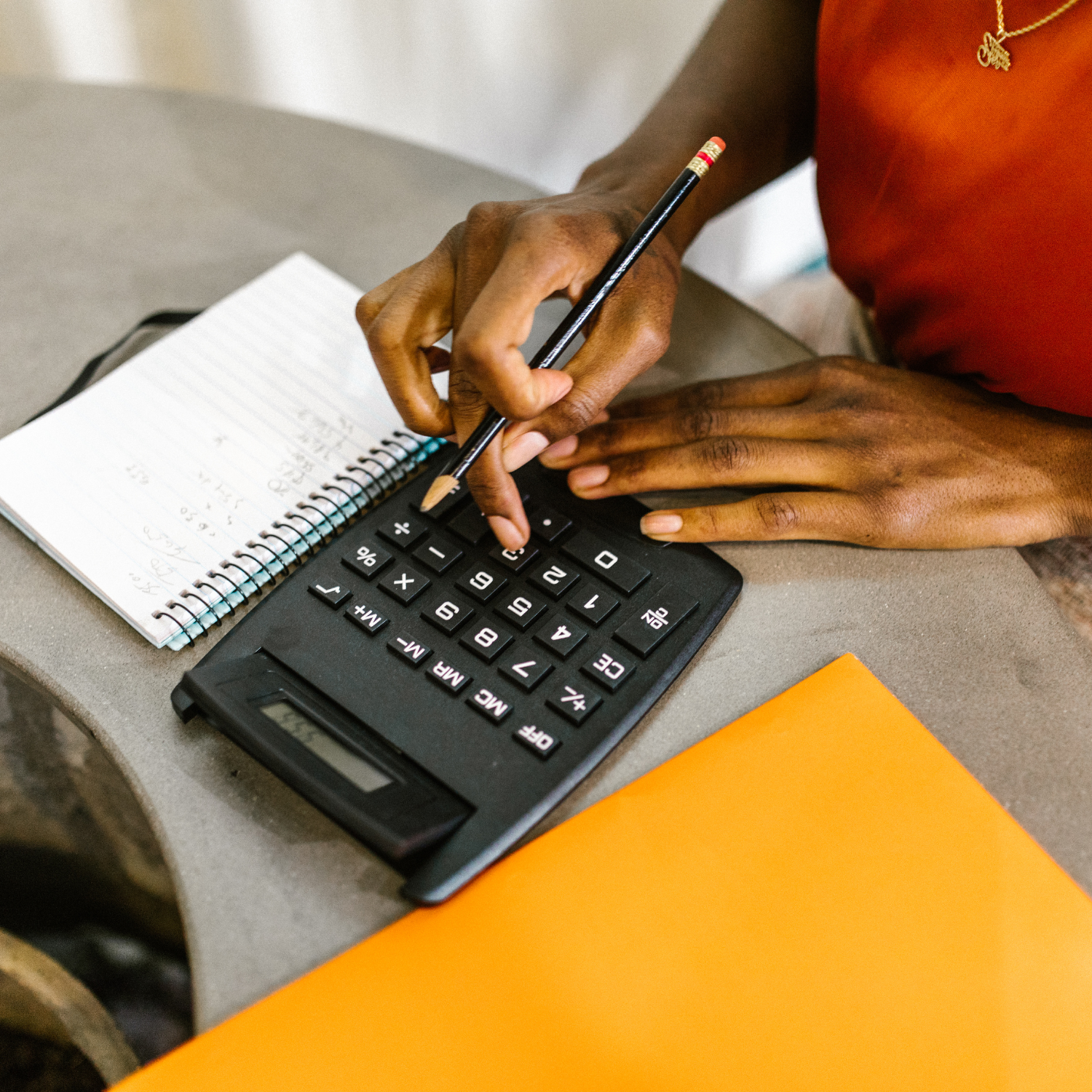 a woman calculating her finances