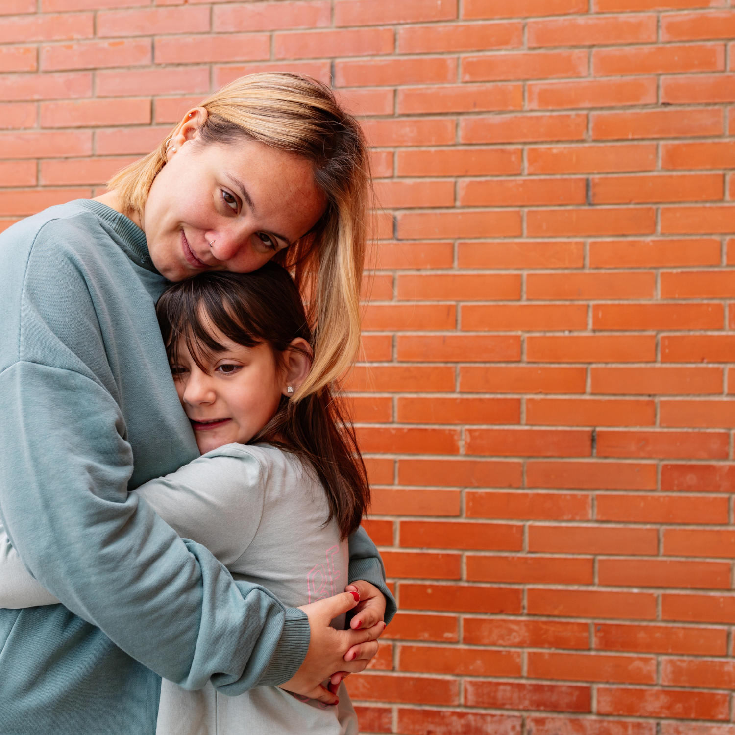 mom and daughter hugging