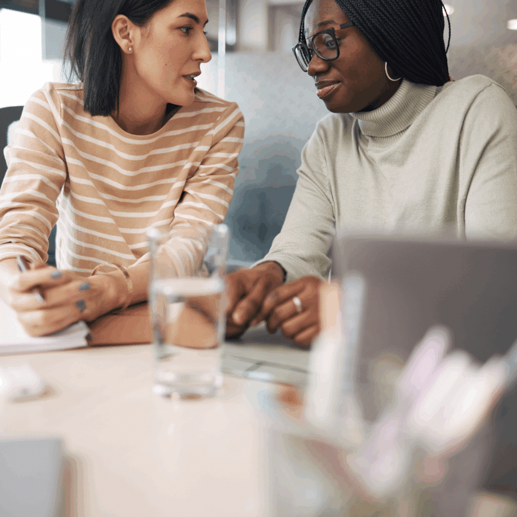 two women discussing finances