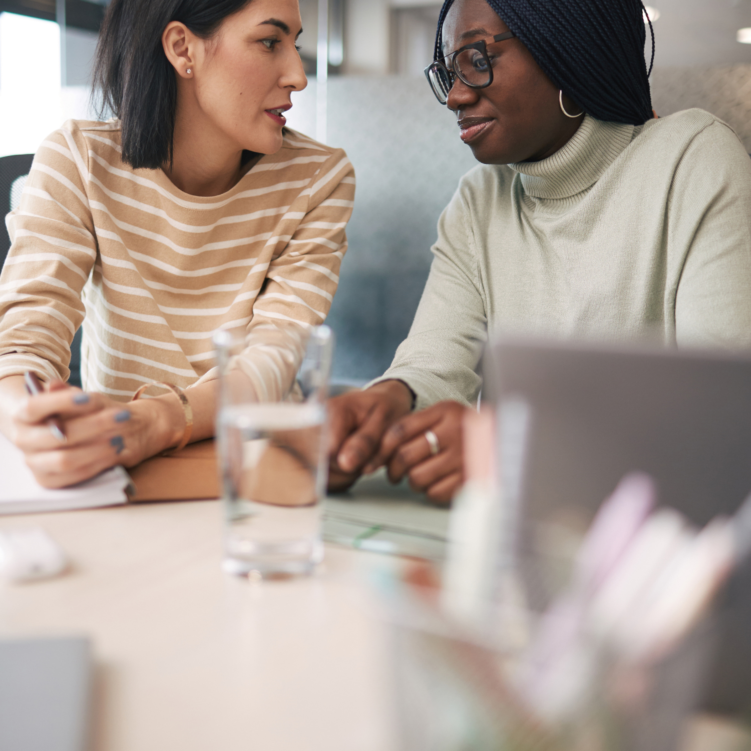 two women discussing finances